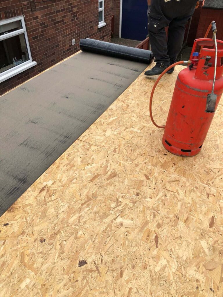 This is a photo of the final layer of a flat roof being installed by EF Roofing Doncaster