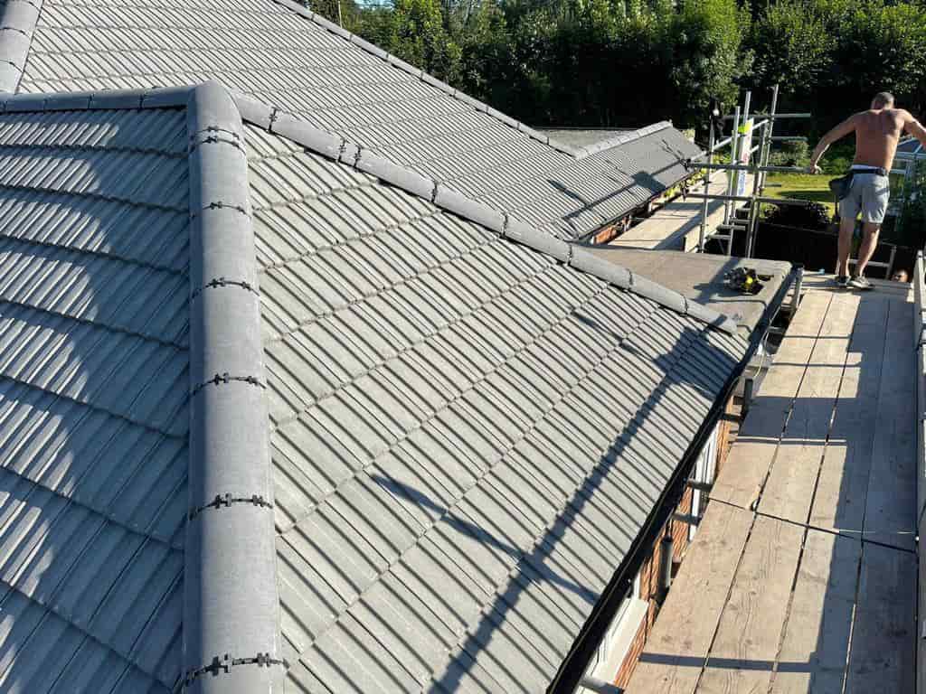 This is a photo of a re-roof that has just been completed with grey roof tiles, and a dry ridge and dry verge by EF Roofing Doncaster