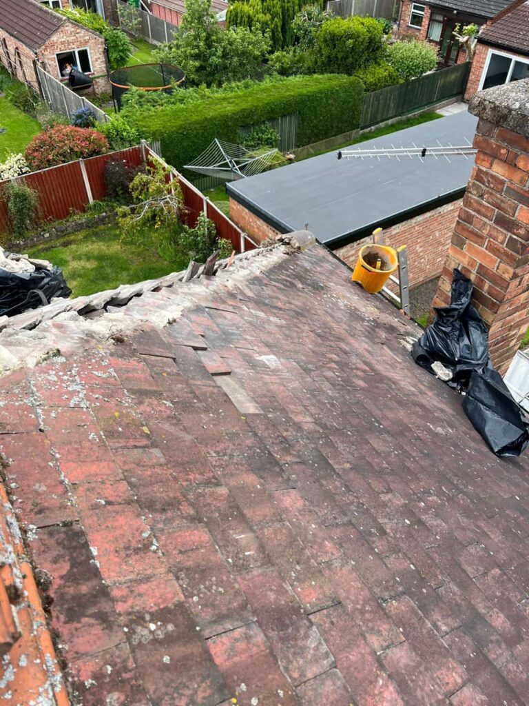 This is a photo of a hip roof where the verge (bonnet) tiles are going to be replaced. They are currently missing by EF Roofing Doncaster